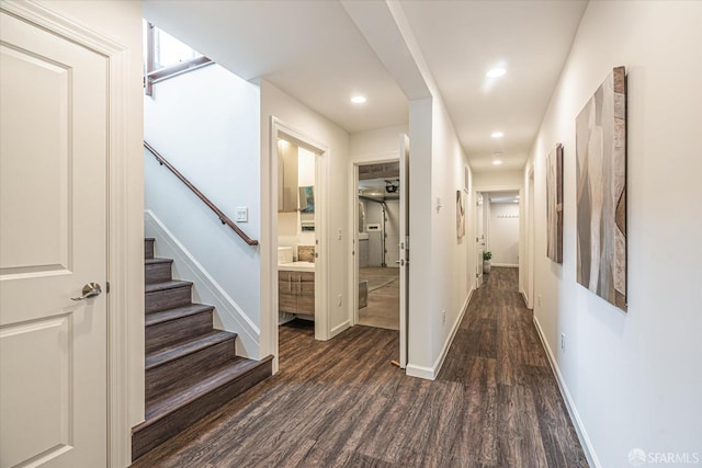 hallway with dark hardwood / wood-style flooring