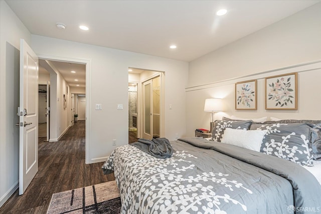 bedroom featuring dark wood-type flooring and a closet