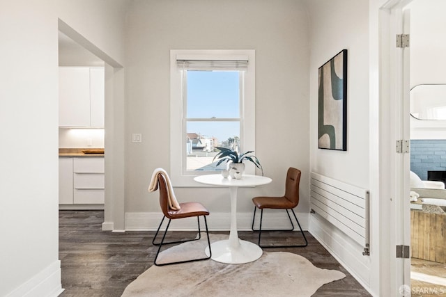 dining space with dark hardwood / wood-style floors