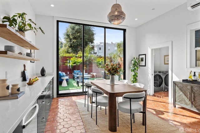 dining area featuring recessed lighting, an AC wall unit, floor to ceiling windows, and washing machine and clothes dryer