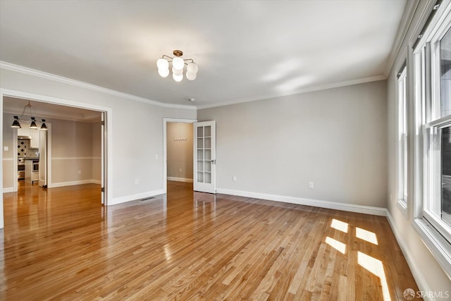 1258 York St, San Francisco, CA 94110 - empty room featuring a chandelier, light wood finished floors, and ornamental molding