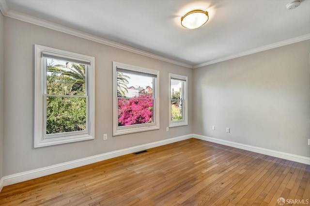1258 York St, San Francisco, CA 94110 - empty room with healthy amount of natural light, wood-type flooring, crown molding, and a smoke detector