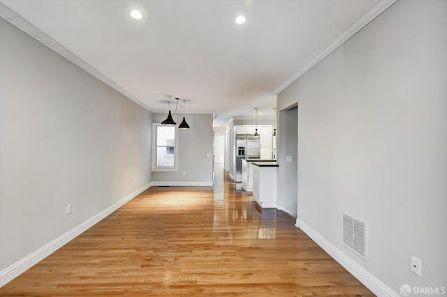 1258 York St, San Francisco, CA 94110 - unfurnished living room with crown molding, light wood finished floors, and recessed lighting