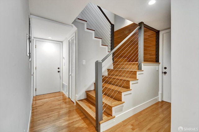1258 York St, San Francisco, CA 94110 - stairs featuring wood finished floors and recessed lighting