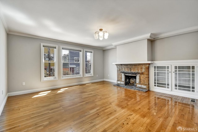 1258 York St, San Francisco, CA 94110 - unfurnished living room with ornamental molding, a fireplace, wood finished floors, and a chandelier