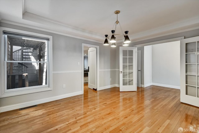 1258 York St, San Francisco, CA 94110 - unfurnished room featuring french doors, ornamental molding, a chandelier, and light wood-style floors
