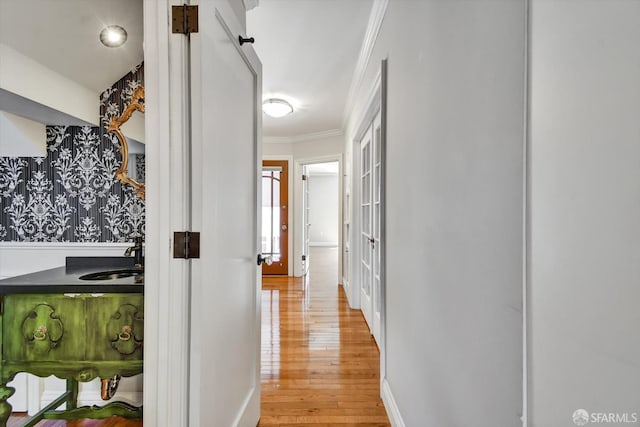 1258 York St, San Francisco, CA 94110 - hallway with light wood-style flooring and ornamental molding
