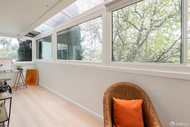 sunroom featuring wood finished floors and baseboards
