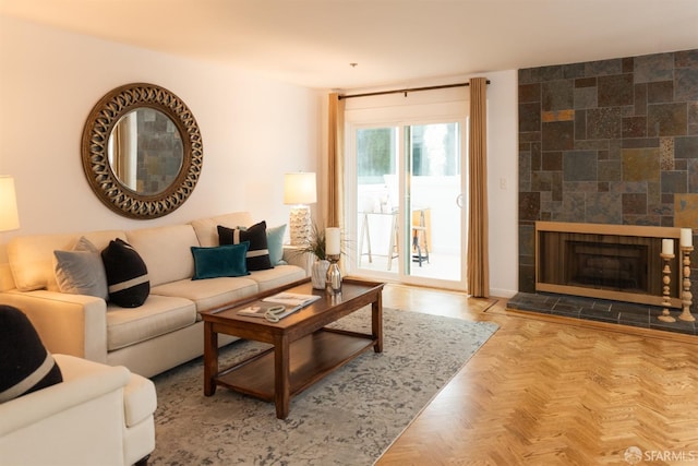 living room with a tiled fireplace