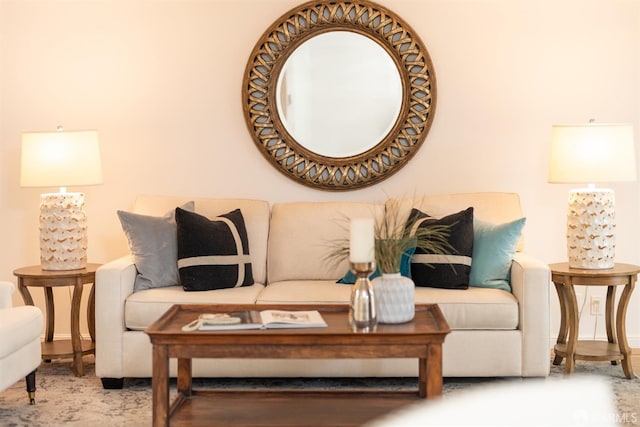 living area featuring baseboards