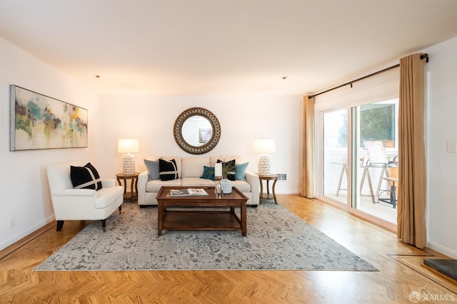 living area featuring baseboards