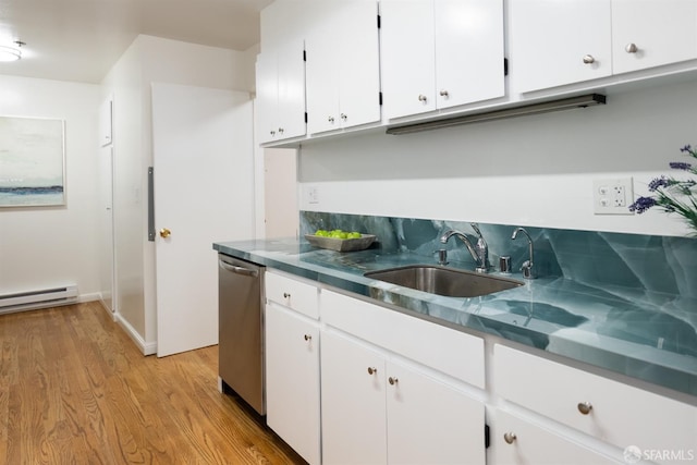 kitchen with baseboard heating, dishwasher, a sink, and white cabinets