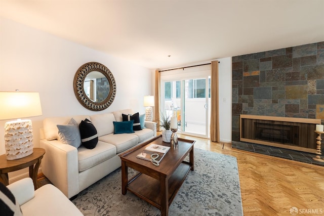living area featuring a tile fireplace