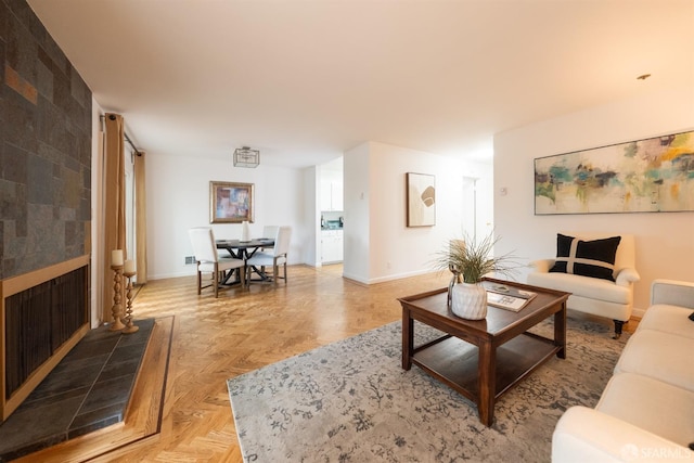 living area featuring baseboards
