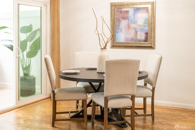 dining area featuring baseboards