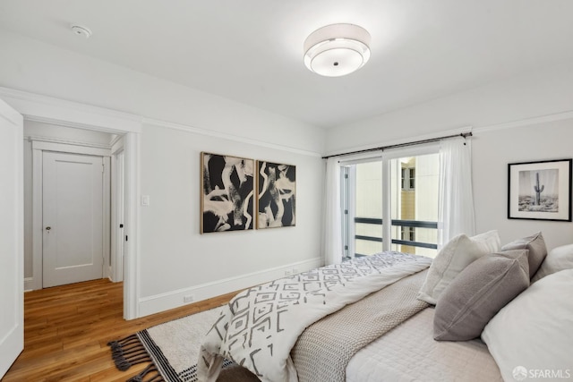 1980-1982 Fell St, San Francisco, CA 94117 - bedroom featuring wood finished floors, access to exterior, and baseboards