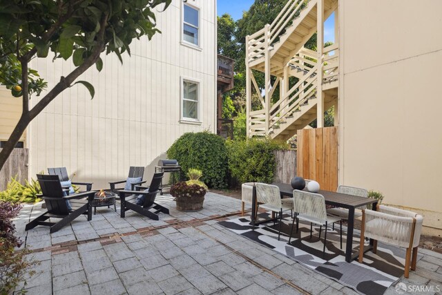 1980-1982 Fell St, San Francisco, CA 94117 - view of patio / terrace featuring a fire pit, stairs, outdoor dining space, and area for grilling