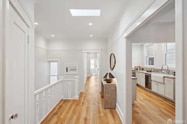 1980-1982 Fell St, San Francisco, CA 94117 - hallway with a sink, a skylight, light wood-style floors, and recessed lighting