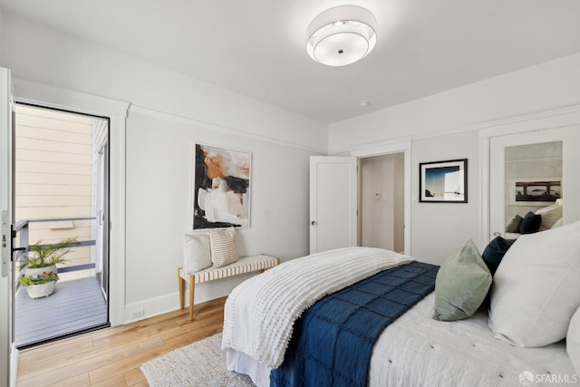 1980-1982 Fell St, San Francisco, CA 94117 - bedroom with light wood-style flooring, baseboards, and access to exterior