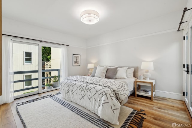 1980-1982 Fell St, San Francisco, CA 94117 - bedroom with light wood-type flooring, baseboards, and access to exterior