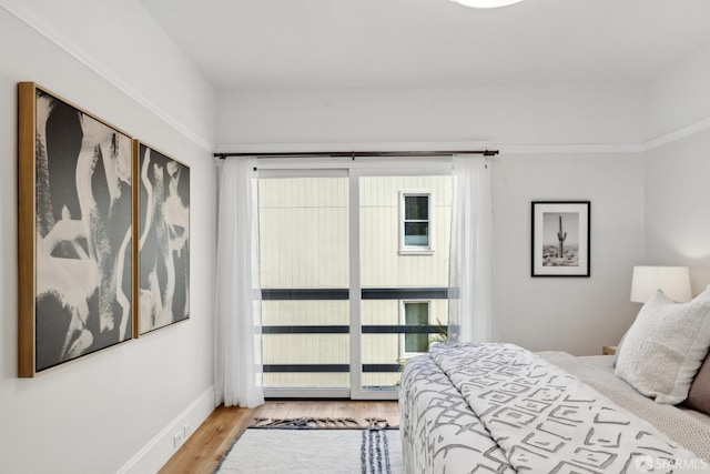 1980-1982 Fell St, San Francisco, CA 94117 - bedroom featuring wood finished floors, multiple windows, and baseboards