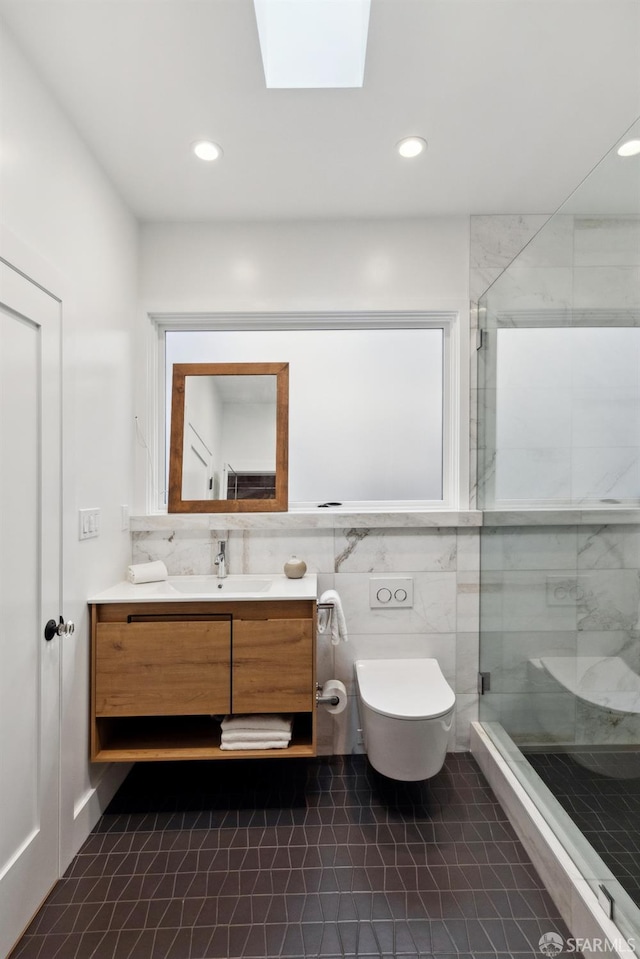 1980-1982 Fell St, San Francisco, CA 94117 - full bathroom featuring vanity, a shower stall, toilet, a skylight, and recessed lighting