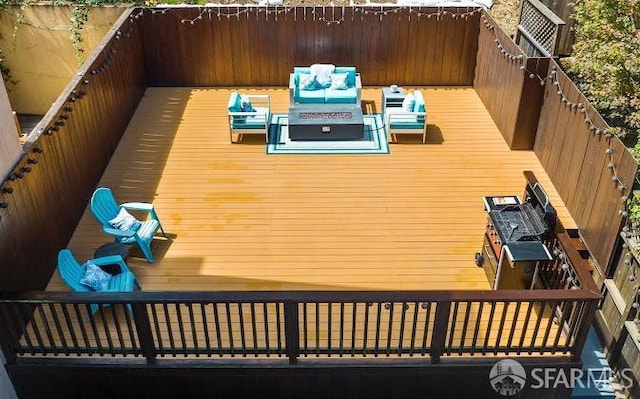 wooden deck featuring outdoor lounge area