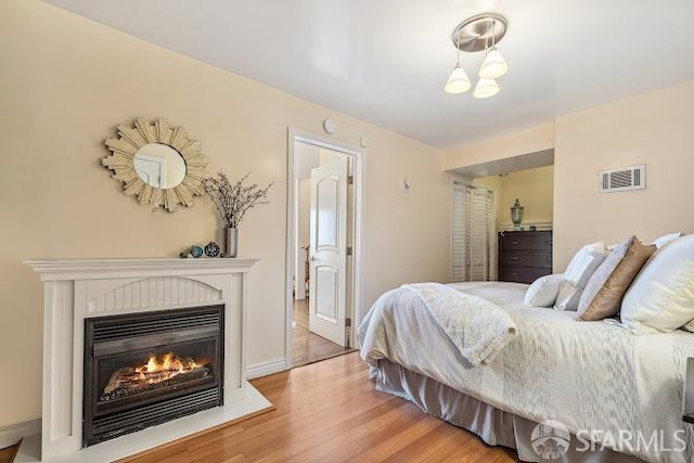 bedroom with light wood-type flooring