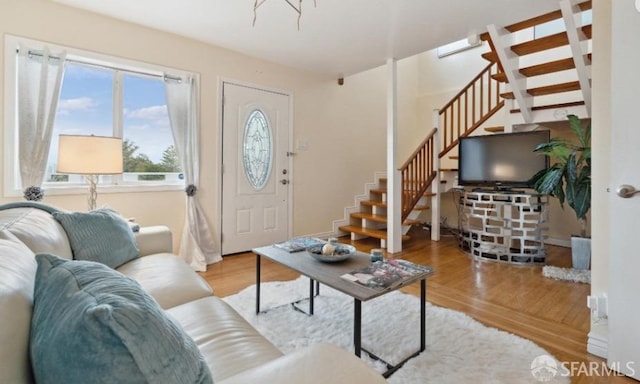 living room with light hardwood / wood-style flooring