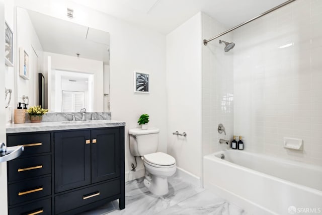 full bathroom with vanity, tiled shower / bath combo, and toilet