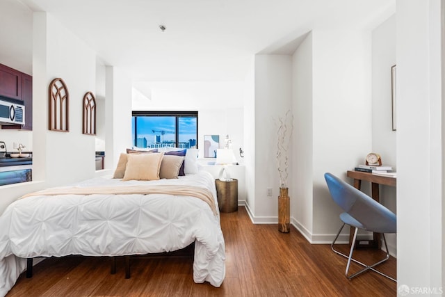 bedroom with wood-type flooring