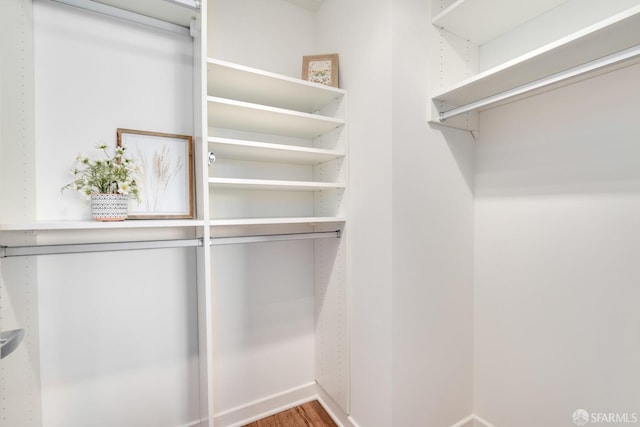 walk in closet featuring hardwood / wood-style flooring