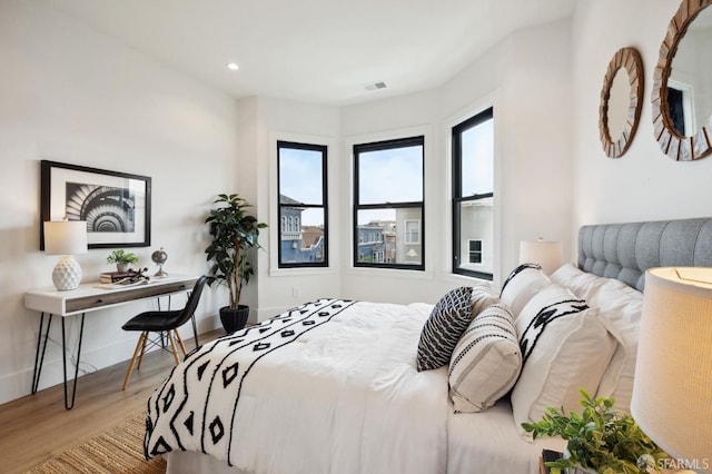 bedroom featuring wood-type flooring