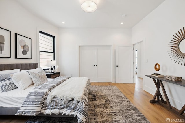 bedroom with light hardwood / wood-style floors