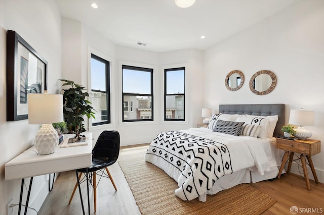 bedroom with wood-type flooring