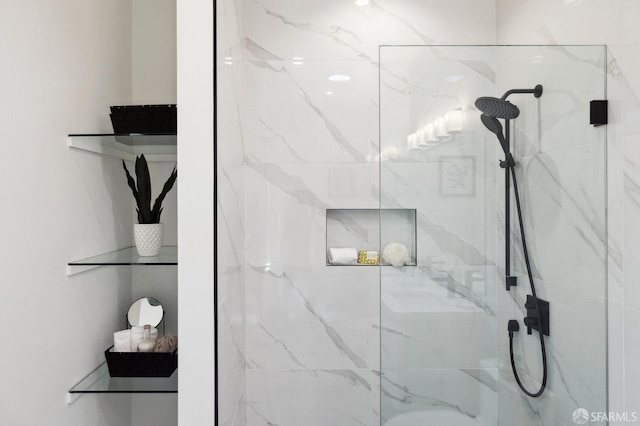 bathroom with tiled shower