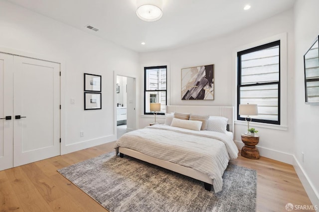 bedroom with light hardwood / wood-style floors