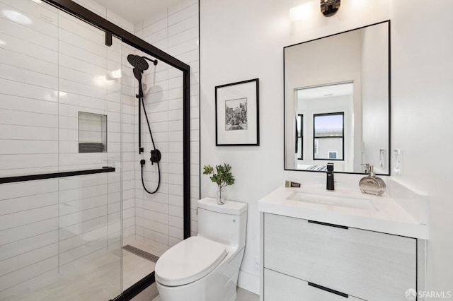 bathroom with vanity, toilet, and an enclosed shower