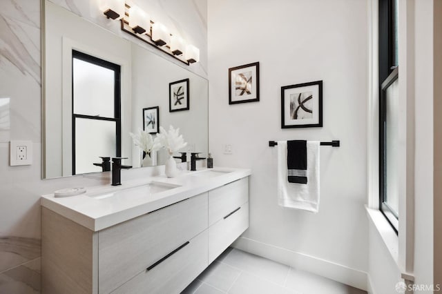 bathroom featuring tile patterned flooring and vanity