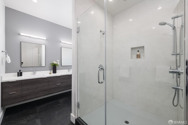 bathroom with walk in shower and vanity