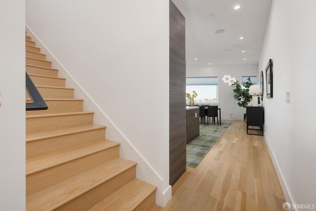 hall with light hardwood / wood-style floors