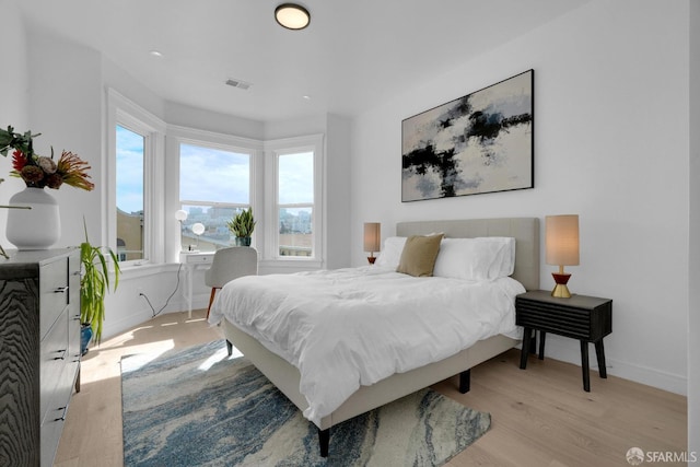 bedroom with light wood-type flooring