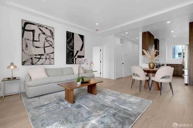 living room with light hardwood / wood-style flooring