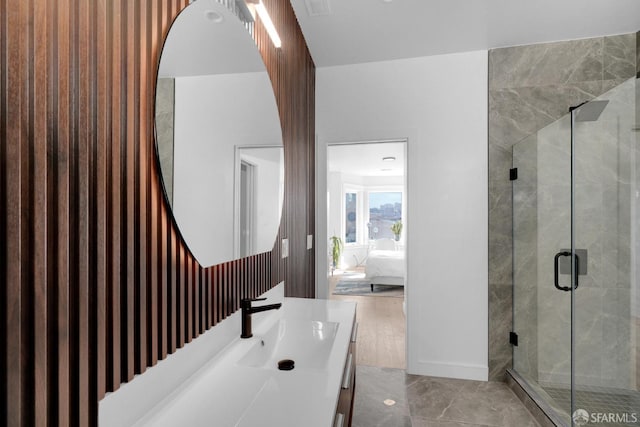 bathroom featuring vanity and an enclosed shower