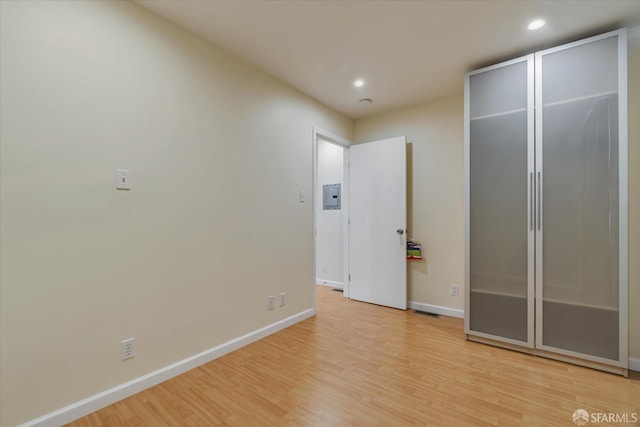 interior space with baseboards, recessed lighting, light wood-style flooring, and visible vents