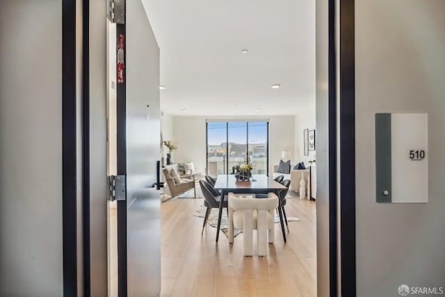 dining space featuring light wood-type flooring