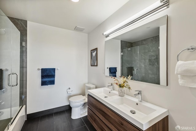 full bathroom with bath / shower combo with glass door, toilet, and vanity