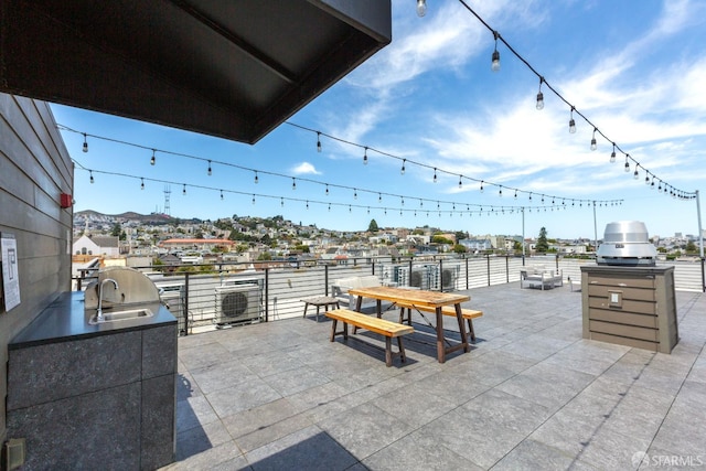 view of patio / terrace with sink and an outdoor kitchen