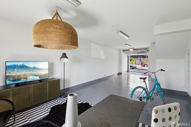 interior space featuring baseboards