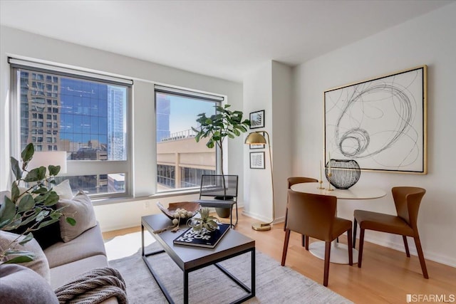 living room featuring light wood-style floors and baseboards